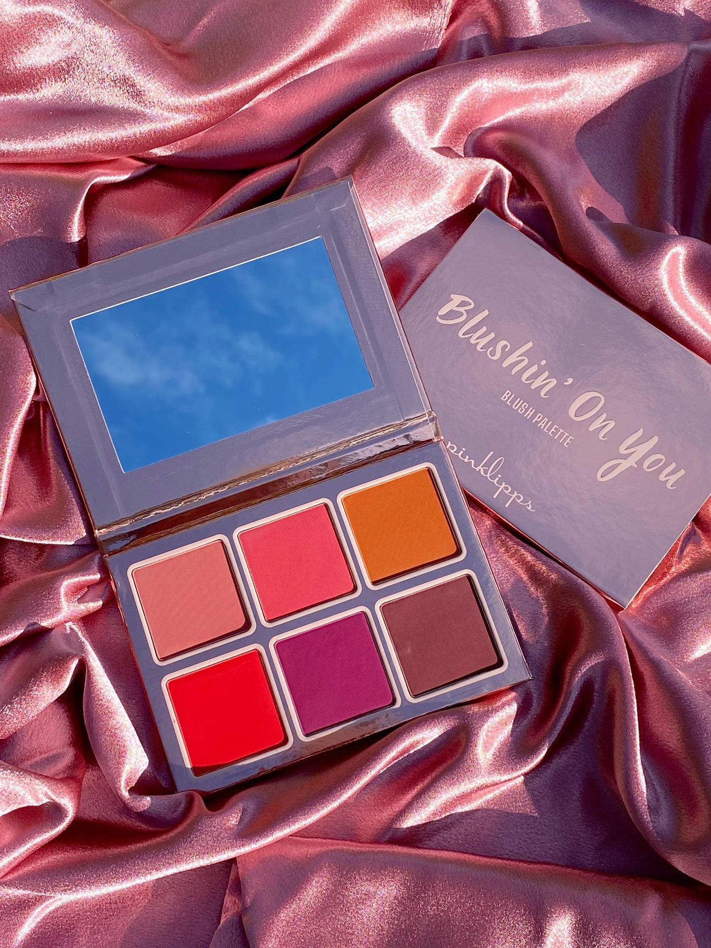 Pink Lipps Blushing’ On You Blush Palette open showing six rich hues: baby pink, rose coral, rich russet, red berry, deep bright purple, deep mauve – clean vegan formula.