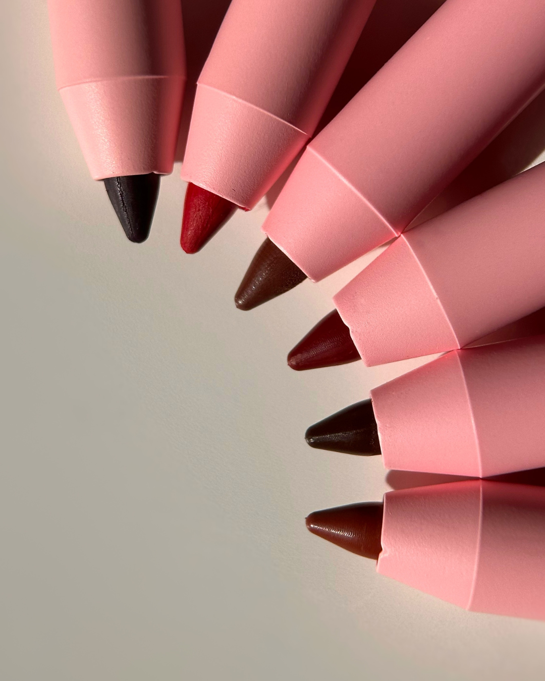 Close-up flat lay of Pink Lipps Everlasting Lip Liner pencil showing creamy matte tip ready for application.