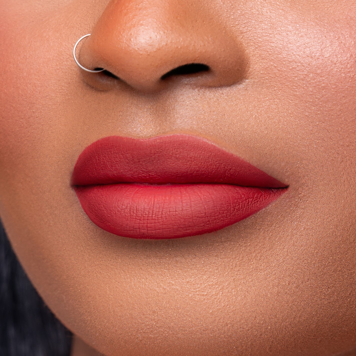 Close up of Pink Lipps Everlasting Matte Liquid Lipstick Cherry Bomb on lips for fair to medium skin tone
