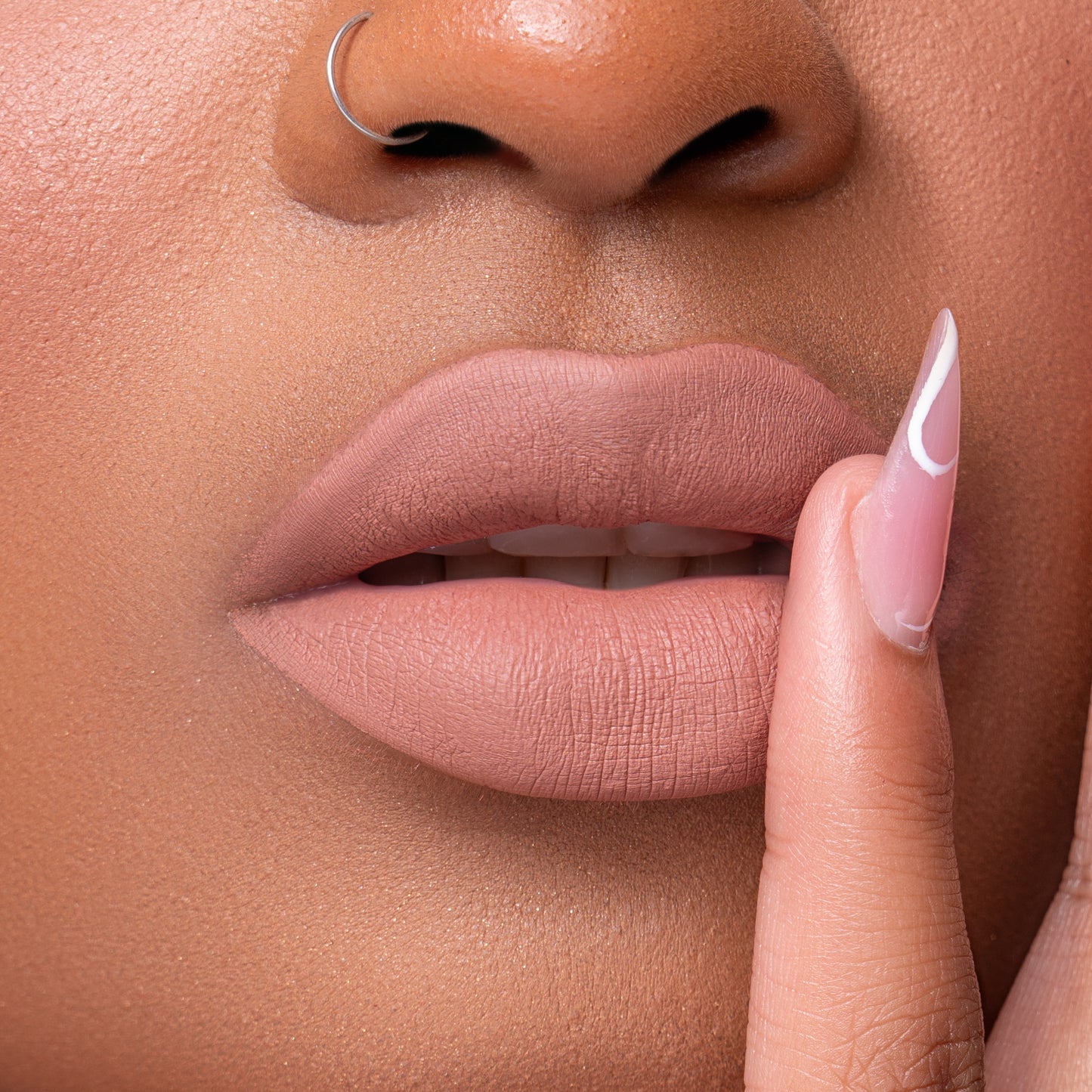 Close up of Pink Lipps Everlasting Matte Liquid Lipstick Nudist on lips for light to medium skin tone