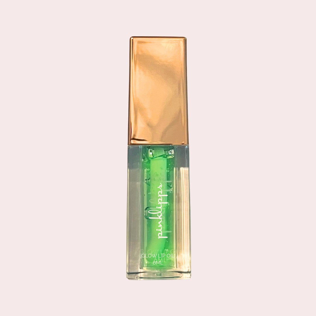 Pink Lipps Taurus Glow Lip Oil tube on white background – clear hydrating gloss with green-apple scent and rose-gold cap