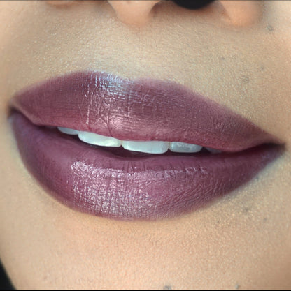 Swatch of Pink Lipps Lumi Balm Lip Tint shade ‘Beauty Sleep’ on fair to medium skin tone – deep purple tint with hydrating finish