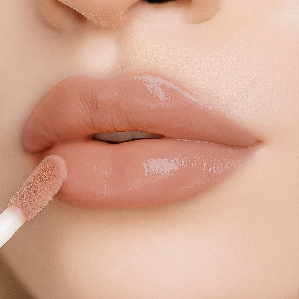 Lip-on model shot: Blush Nude Glass Gloss applied on fair skin tone — pigmented high-shine finish