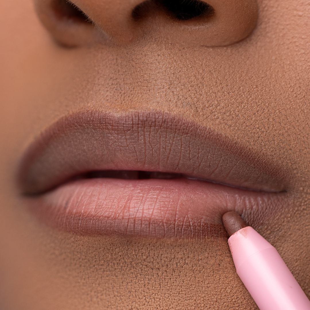 Lip model of Pink Lipps Everlasting 'Brown' Lip Liner showcasing brown on melanin skin tone and lips