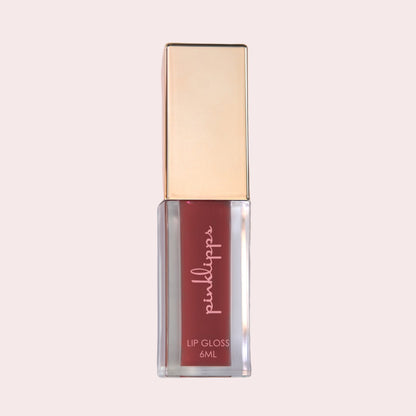 Pink Lipps Burgundy Bold Lip Gloss tube on white background – sleek burgundy gloss with rose-gold cap and bold pigment