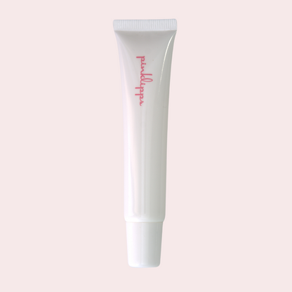Pink Lipps C-Thru LippEase Tinted Lip Treatments tube on white background – sleek clear lip balm in white tube