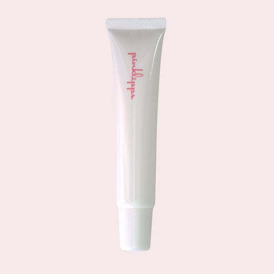 Pink Lipps C-Thru LippEase Tinted Lip Treatments tube on white background – sleek clear lip balm in white tube