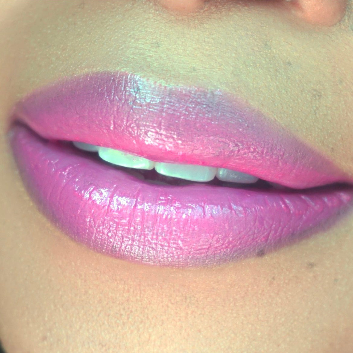 Swatch of Pink Lipps Lumi Balm Lip Tint shade ‘Dream’ on light skin tone – soft pink wash of color with a balm-gloss feel