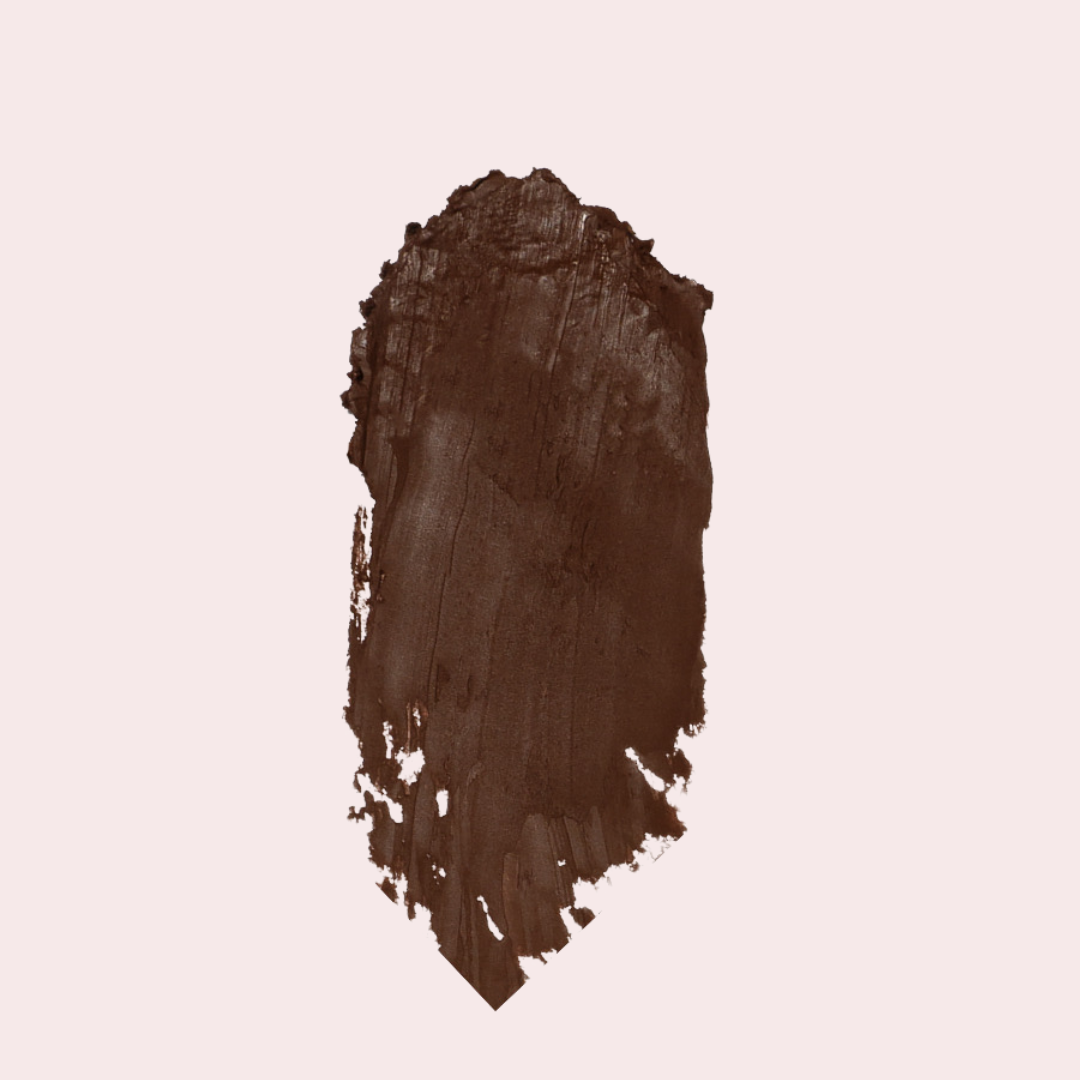 Macro texture shot of 'Espresso' Soft Matte Contour Stick formula on skin — soft-matte finish, no harsh lines, buildable contour.