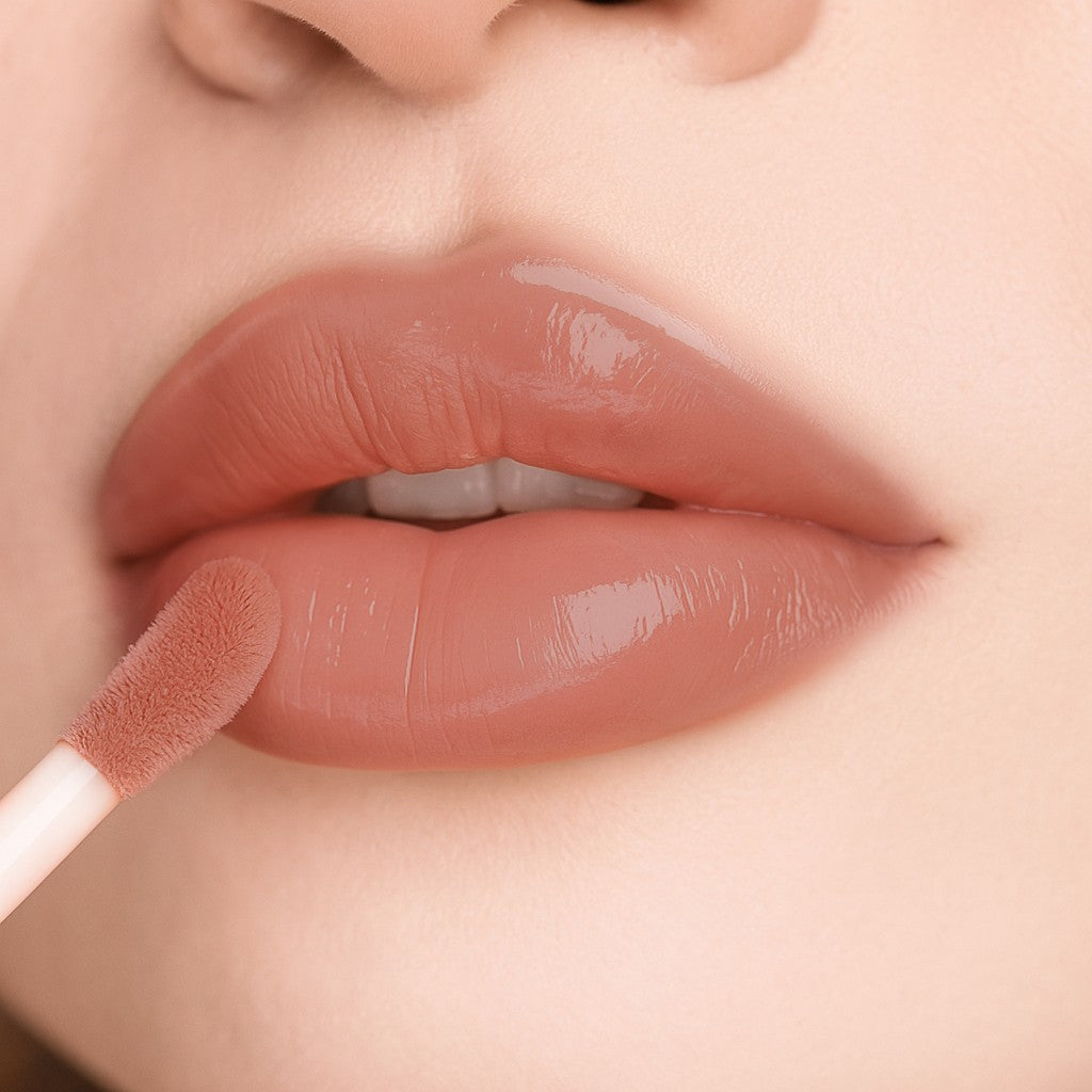 Lip-on model shot: Expose Me Nude Glass Gloss applied on fair skin tone — pigmented high-shine finish