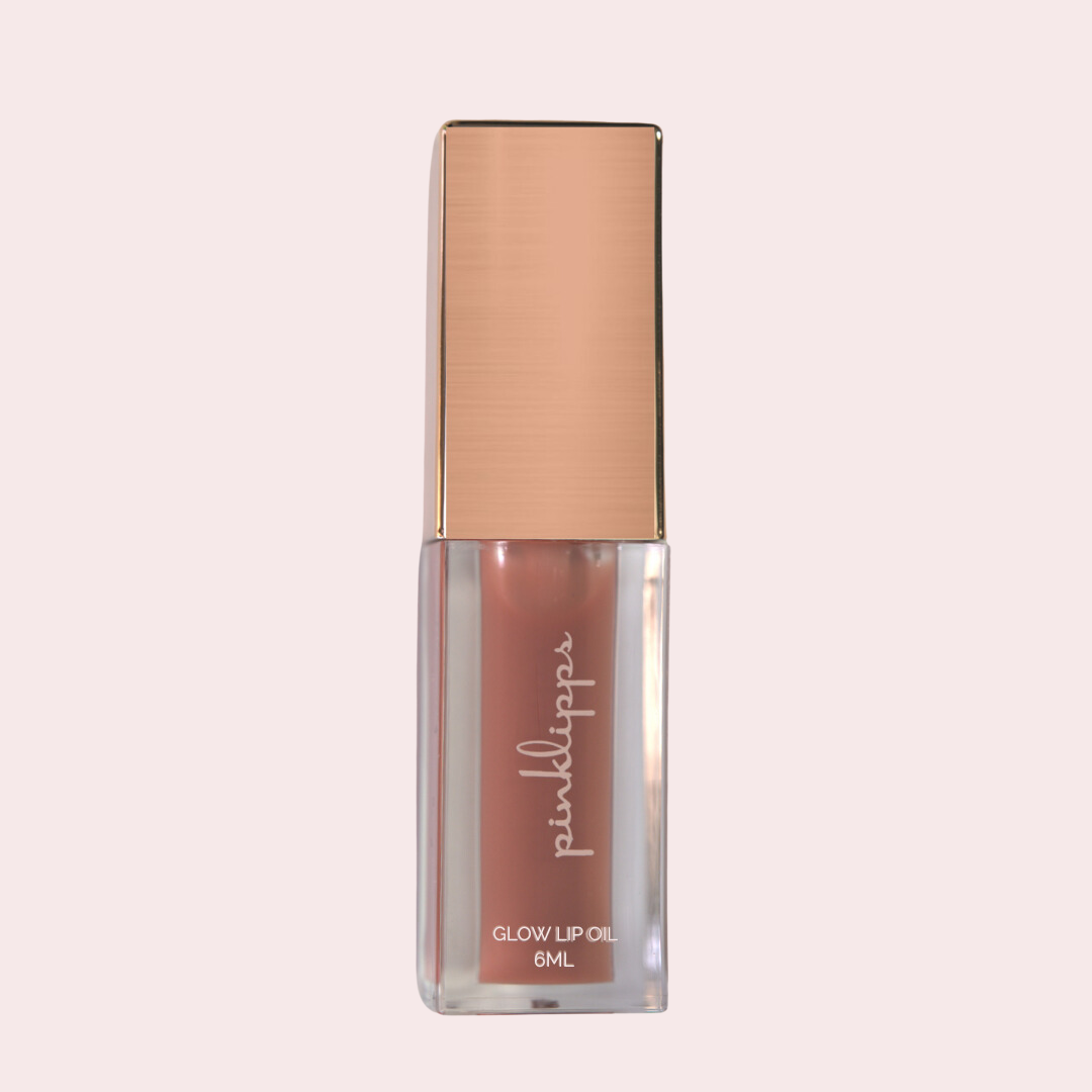 Pink Lipps 'Halo' Glow Lip Oil tube on white background, donut scent vegan high-shine nude lip oil for every shade of melanin.