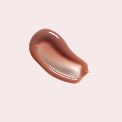 Swatch of LippEase Tinted Lip Treatments ‘HER’ (nude high-shine balm) showing glassy finish
