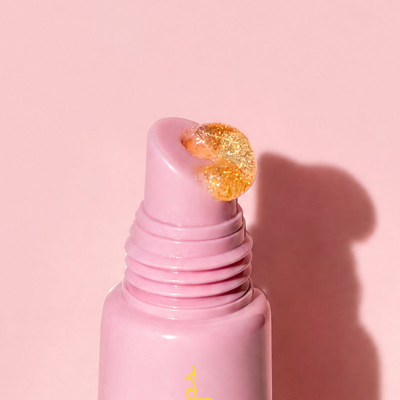 Close-up of Lemon Lip Glaze Sparkly Lip Balm, a hydrating lip balm with shimmering gloss, perfect for glazed lips.