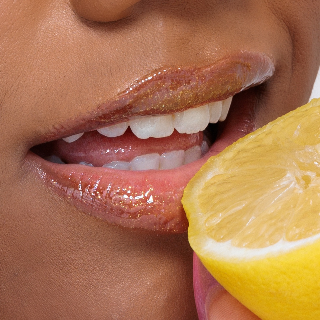 Close-up of lips with Lemon Lip Glaze Sparkly Lip Balm, showcasing glossy, hydrated shine. Perfect hydrating lip balm experience.