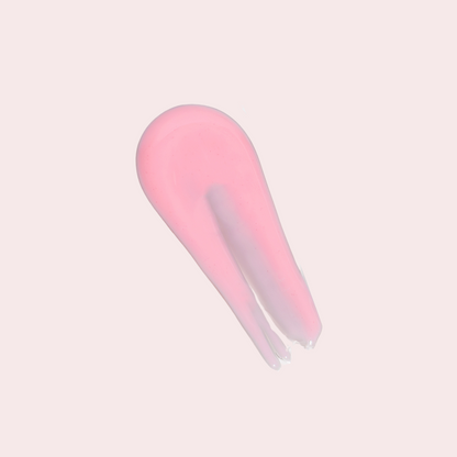 Swatch of LippEase Tinted Lip Treatments ‘Power’ (pink high-shine balm) showing glassy finish