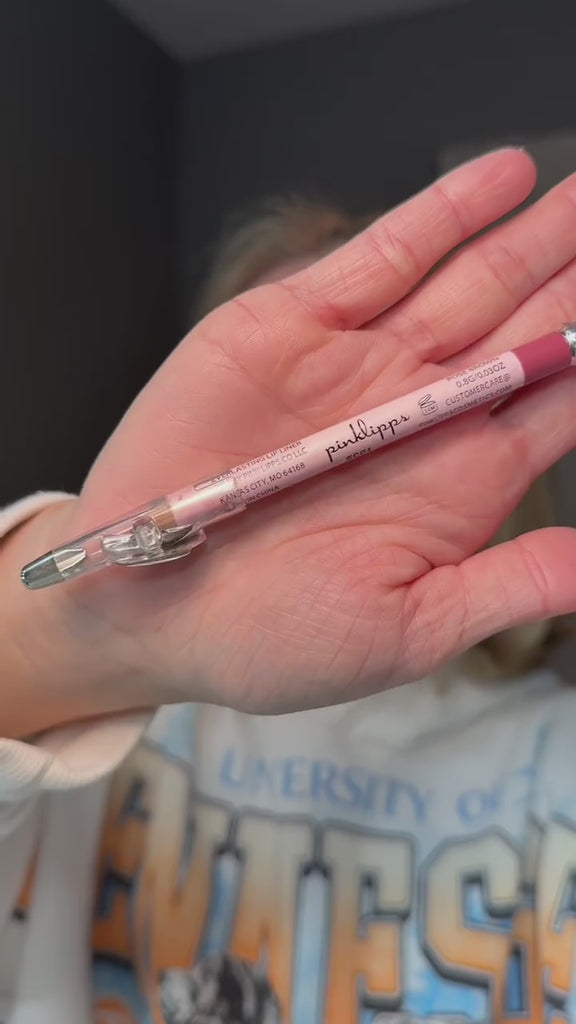 fair skin woman applying Rose Brown Lip liner by pink Lipps Cosmetics