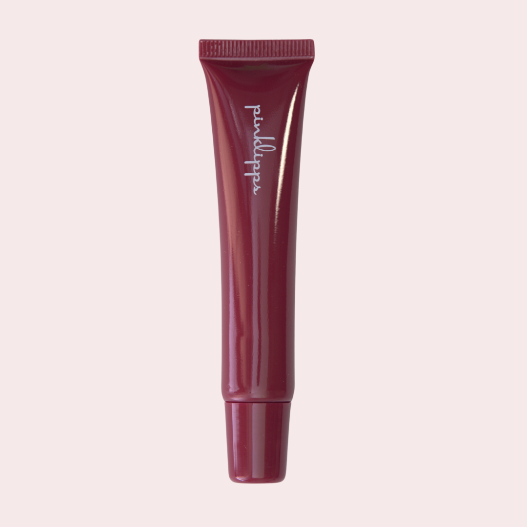 Pink Lipps Rich LippEase Tinted Lip Treatments tube on white background – sleek burgundy lip balm in burgundy tube