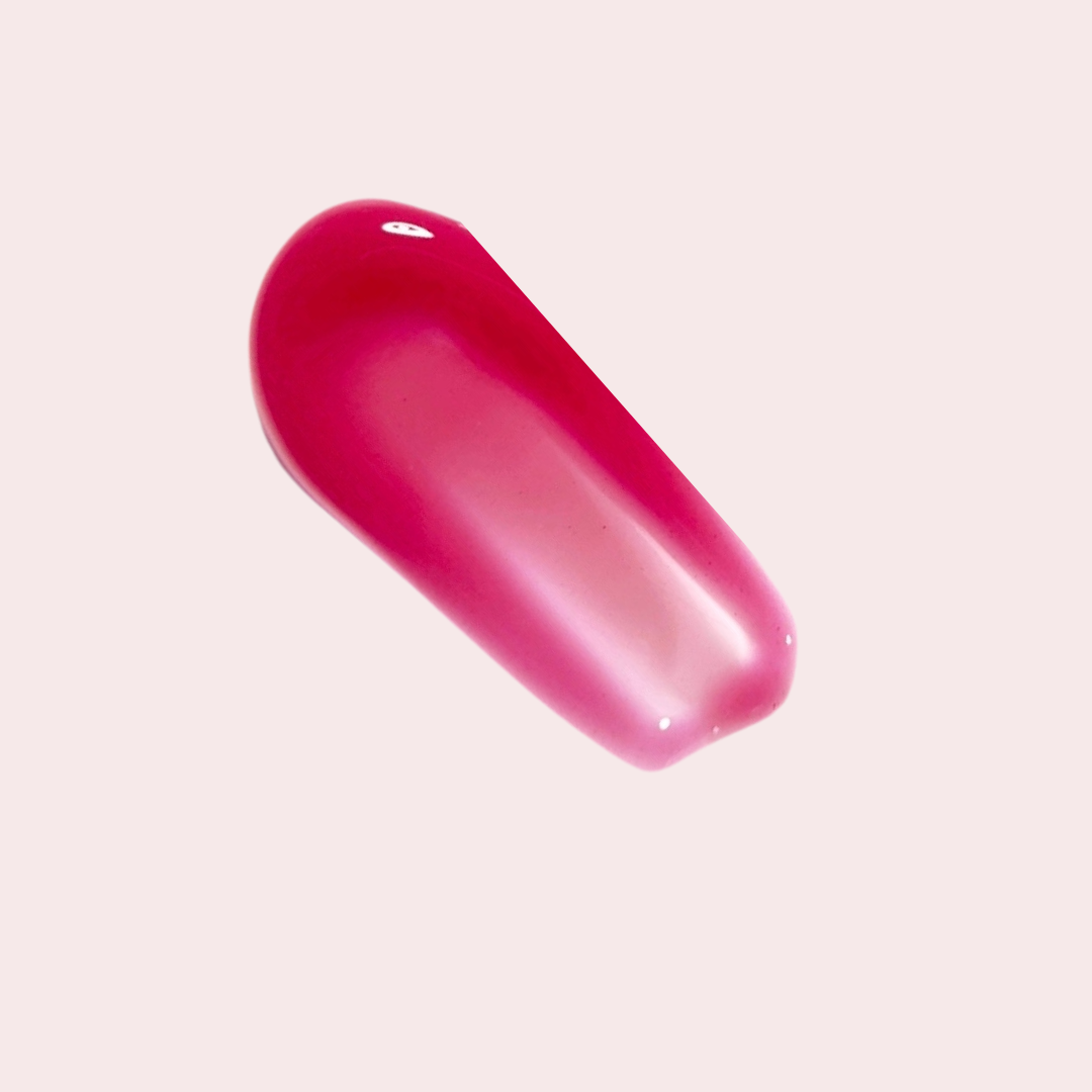 Swatch of LippEase Tinted Lip Treatments ‘Rich’ (berry high-shine balm) showing glassy finish