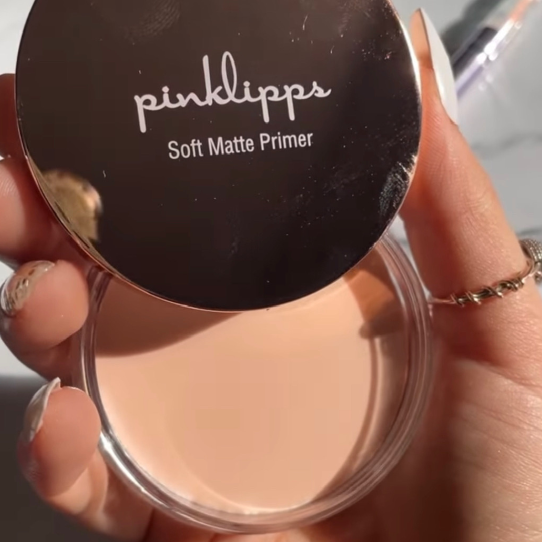 Close-up of Soft Matte Primer and cap in rose-gold finish – smooth gel texture visible