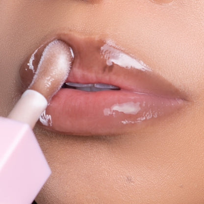 Lip model shot of brown SunKissed Glow Lip Oil applied over light skin tone – radiant glass finish with hydrating glow.