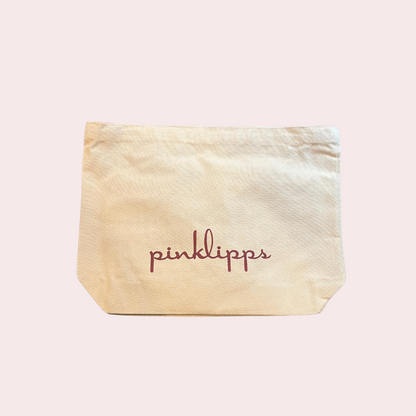 “Pink Lipps Tote Bag tan-neutral canvas with burgundy silk straps – front view on white background”