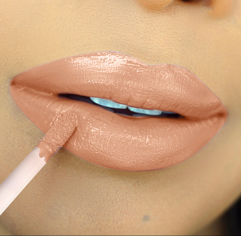 Neutral Brown Liner Lip Combos Lip-on model shot: Unfair Nude Glass Gloss applied on light skin tone — pigmented high-shine finish