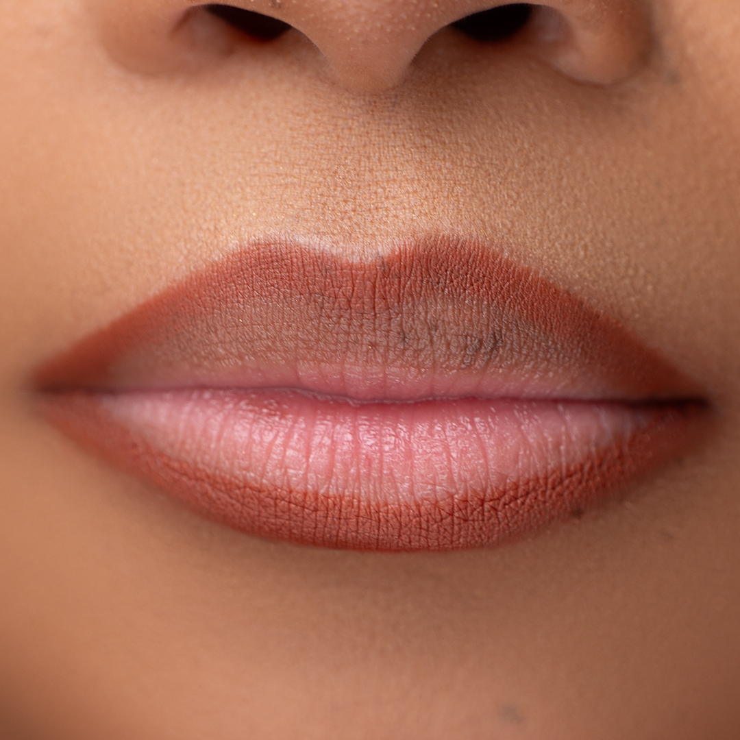 Lip model of Pink Lipps Everlasting 'Warm Brown' Lip Liner showcasing warm brown on light skin tone and lips